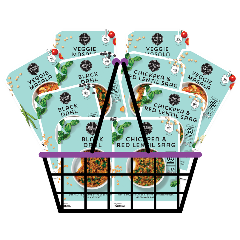 A basket overflowing with 10 Strong Roots Good Made Easy meals, featuring products from the Indian Inspired Bundle.